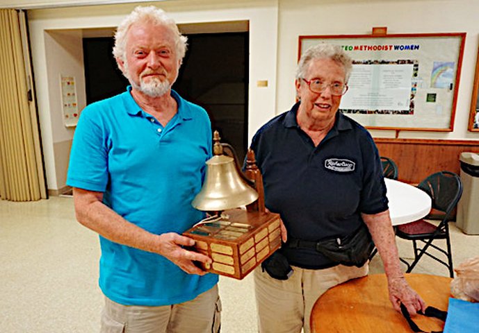 Howard Kirby from Iroquois, Ontario wins the annual Best Boat and People's Choice Trophies for his boat, White Cap presented by Jan Beall, the Richardson Rendezvous planner.